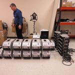 Pat McGuane and row of Power Gems ballasts, Open House, Atlanta