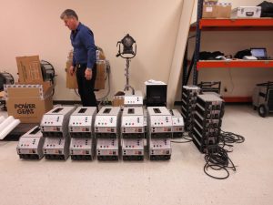 Pat McGuane and row of Power Gems ballasts, Open House, Atlanta