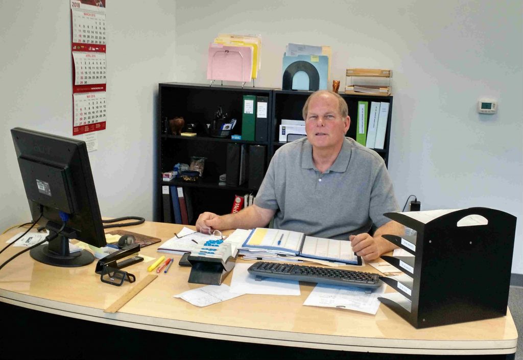 Chip Harley at his desk in new Los Angeles Power Gems facility