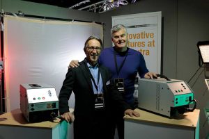 Antonio Cazzaniga of ONVIDEO with Patrick McGuane of Power Gems at the MicroSalon Italia booth with ballasts on display