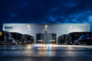 PixiPixel warehouse with vehicles lined up