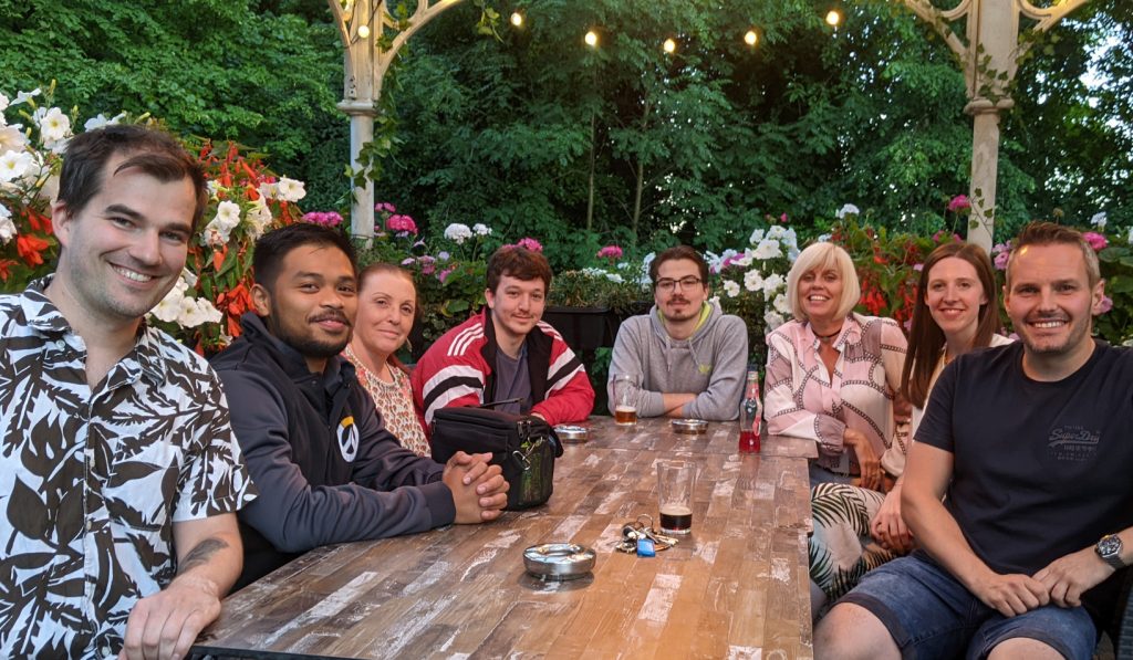 Francis Cuevas and Power Gems team outdoors at The John Gilbert