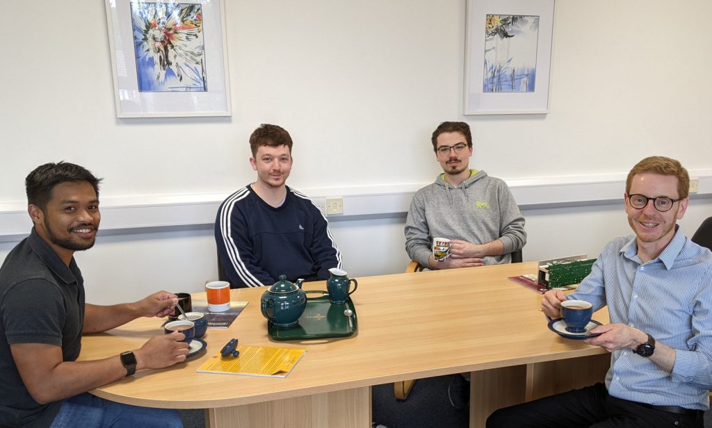 Four of the Power Gems team drinking tea at the Manchester HQ